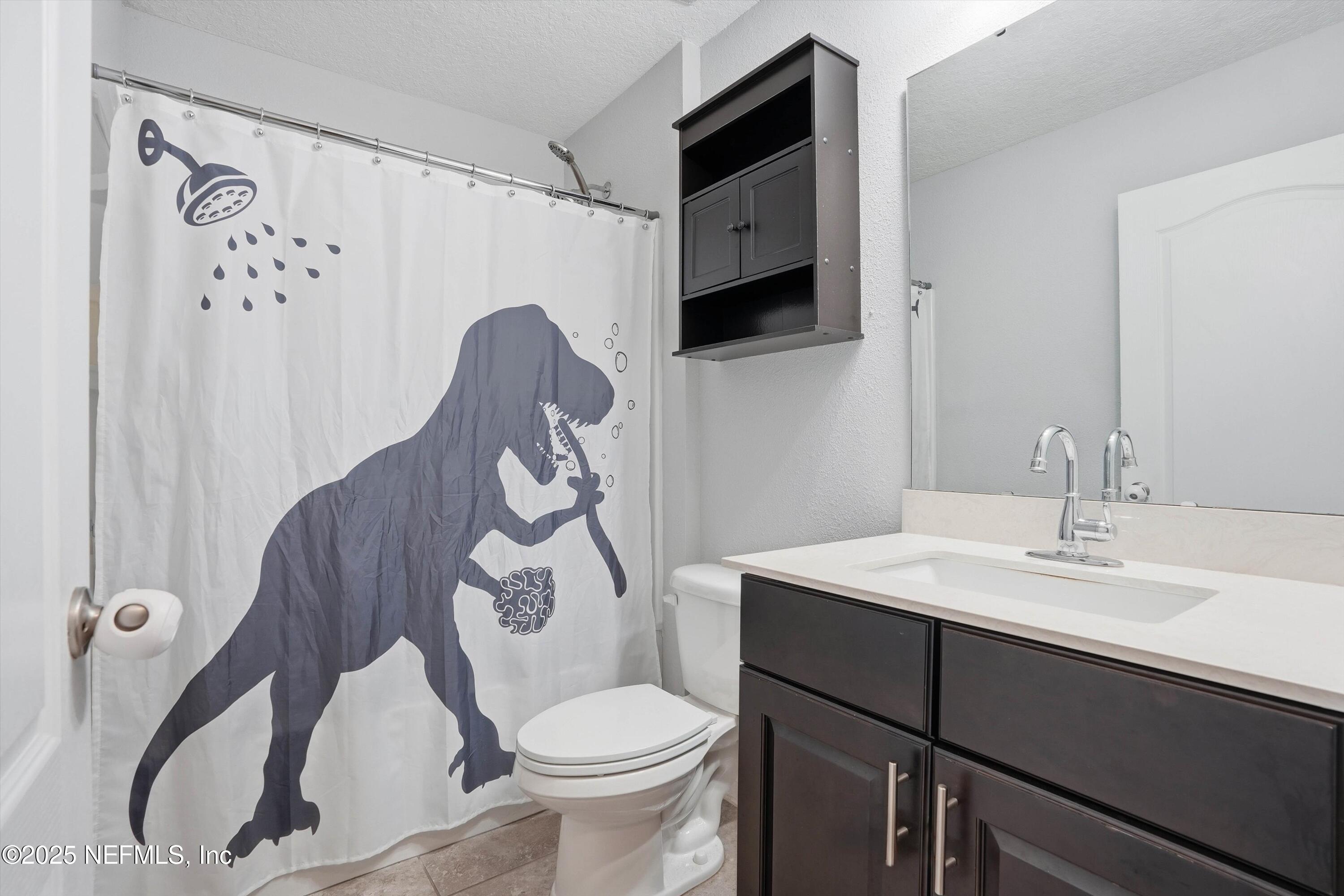 3994 Great Falls Loop Middleburg, FL 32068 - Photo 22 of 30 a bathroom with a sink toilet and shower