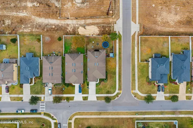 a bathroom with a mirror and shower
