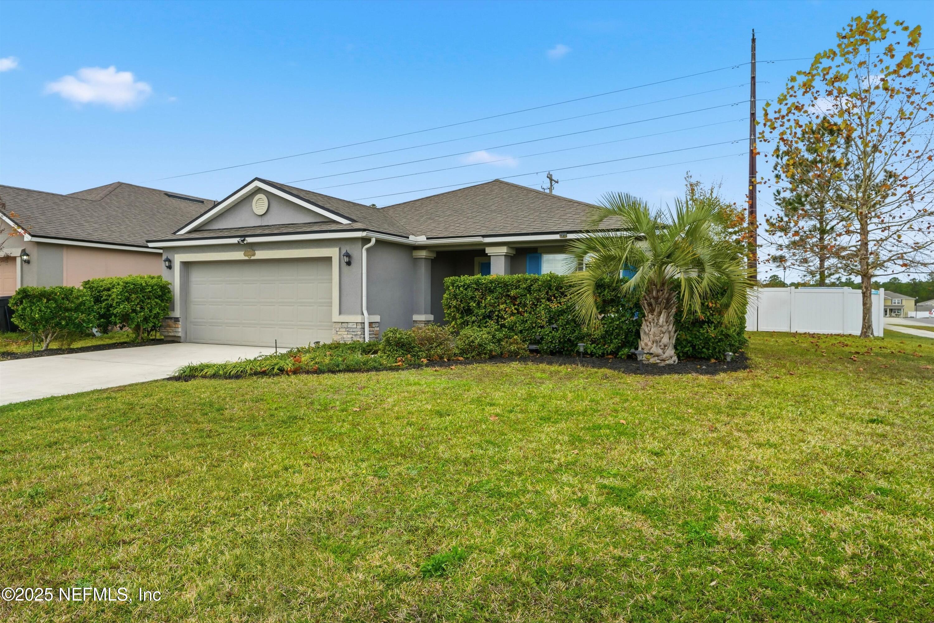 3994 Great Falls Loop Middleburg, FL 32068 - Photo 3 of 30 a front view of a house with garden