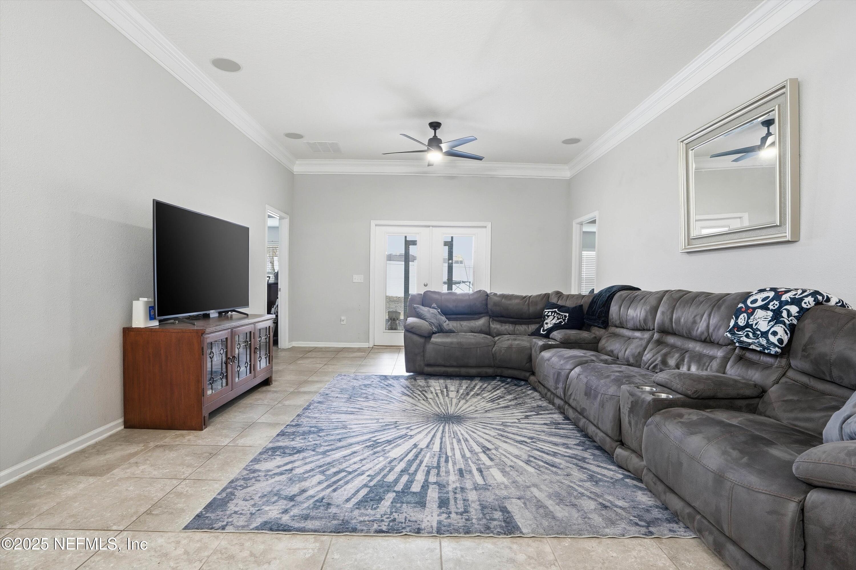 3994 Great Falls Loop Middleburg, FL 32068 - Photo 6 of 30 a living room with furniture and a flat screen tv