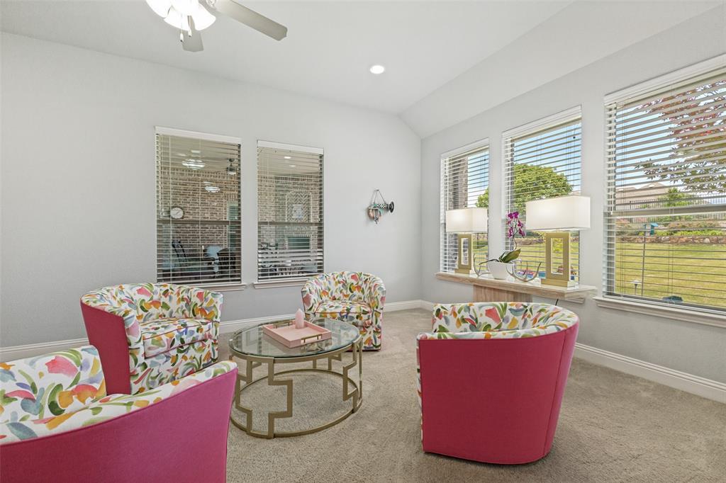506 Life Spring Drive Rockwall, TX 75087 - Photo 17 of 36 a living room with furniture and floor to ceiling windows