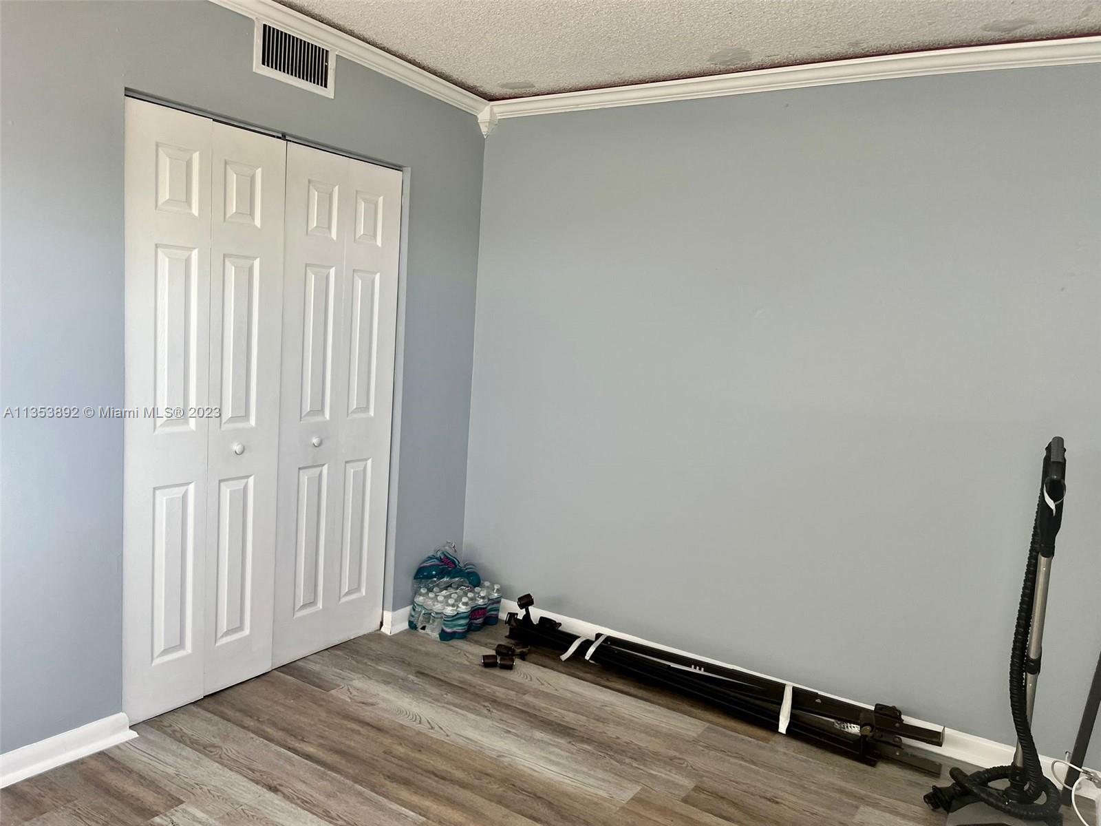 500 Davis Road, Unit 30 Palm Springs, FL 33461 - Photo 11 of 15 a view of a room with wooden floor and windows