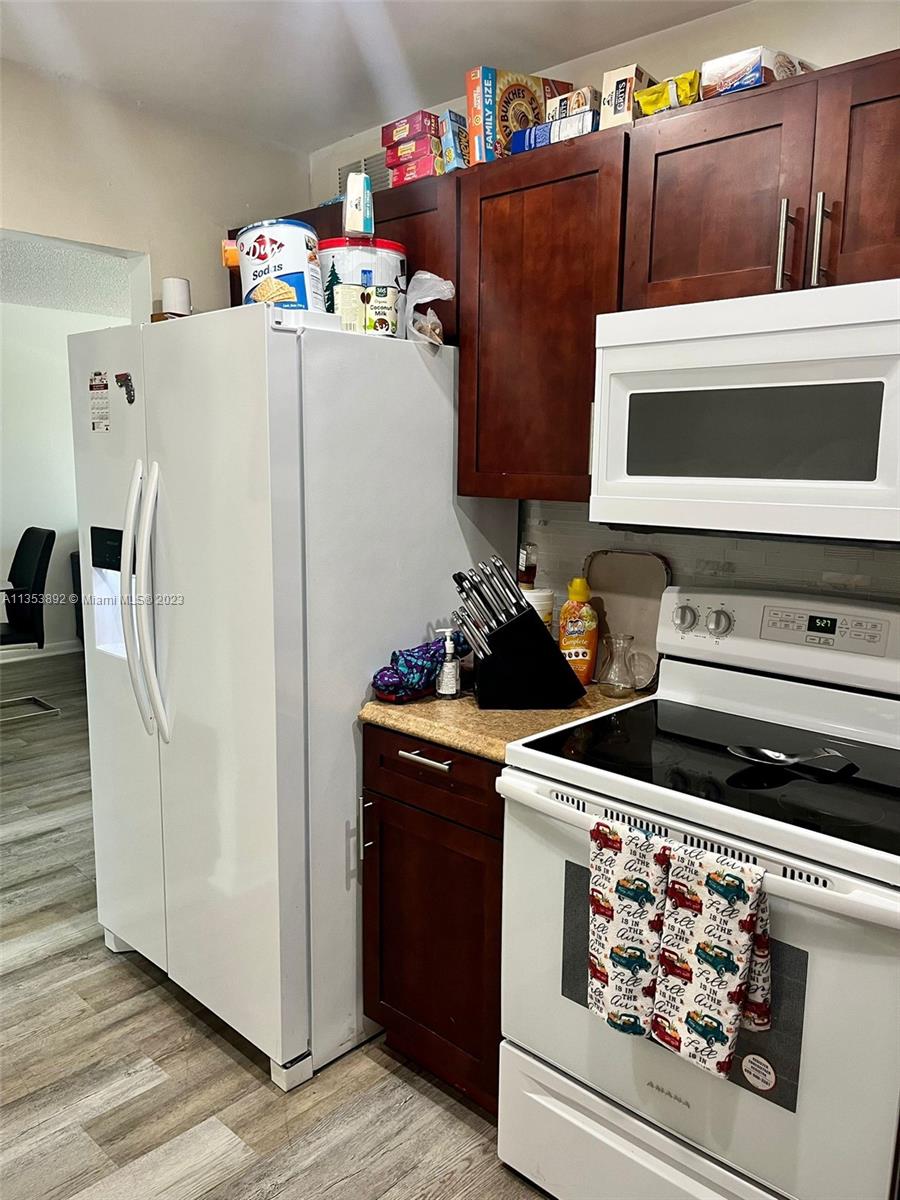 500 Davis Road, Unit 30 Palm Springs, FL 33461 - Photo 6 of 15 a white refrigerator freezer sitting inside of a kitchen