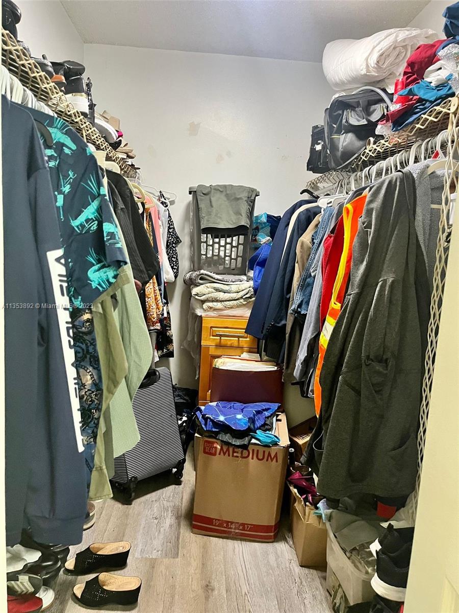 500 Davis Road, Unit 30 Palm Springs, FL 33461 - Photo 10 of 15 a view of walk in closet with clothes and shoes