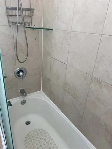 a bathroom with a sink vanity and a mirror