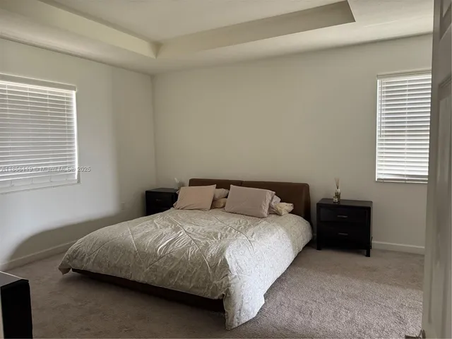 a view of a hallway with windows