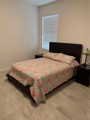 a bathroom with a toilet a sink and shower