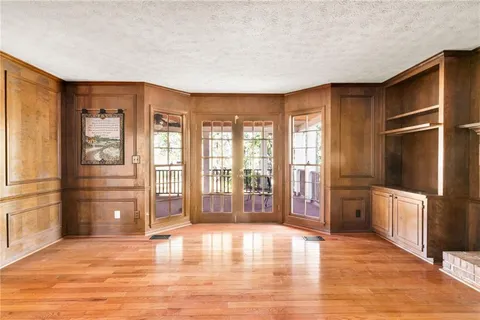 a large kitchen with stainless steel appliances granite countertop a refrigerator and a stove top oven