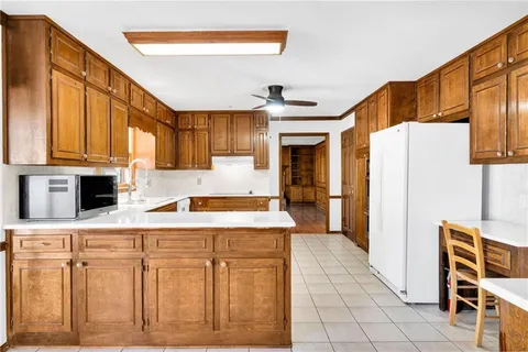 a kitchen with stainless steel appliances a refrigerator and cabinets