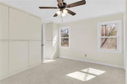 an empty room with a empty space and ceiling fan