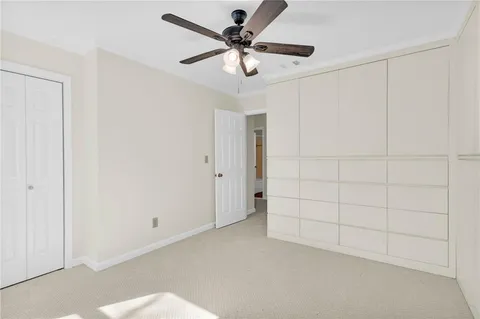a bathroom with a sink toilet and window