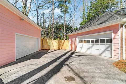 a front view of a house with a yard and glass windows