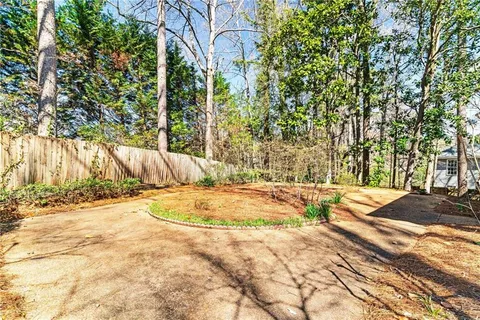 a view of a house with snow in the yard