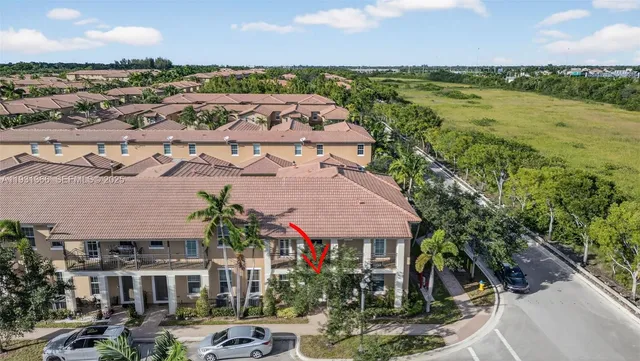 a aerial view of multiple houses with yard
