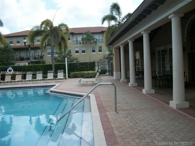 a view of a house with swimming pool