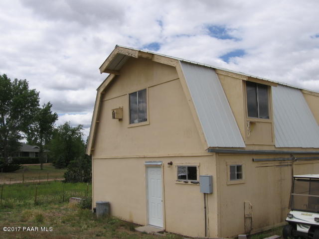 1120 North Moon Shadow Road Chino Valley, AZ 86323 - Photo 13 of 18 a house with trees in front of it