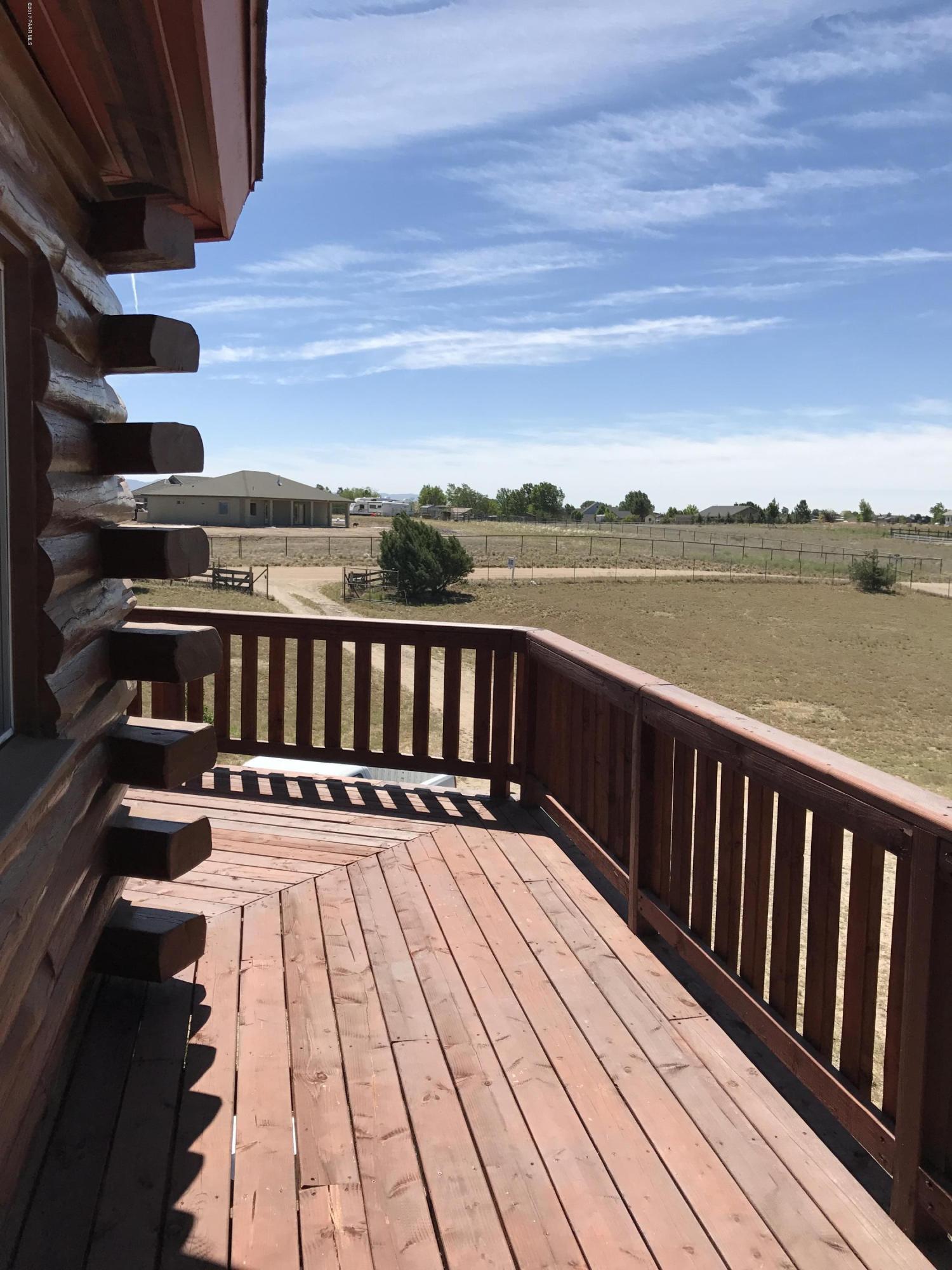 1120 North Moon Shadow Road Chino Valley, AZ 86323 - Photo 17 of 18 a view of balcony with wooden floor and lake view