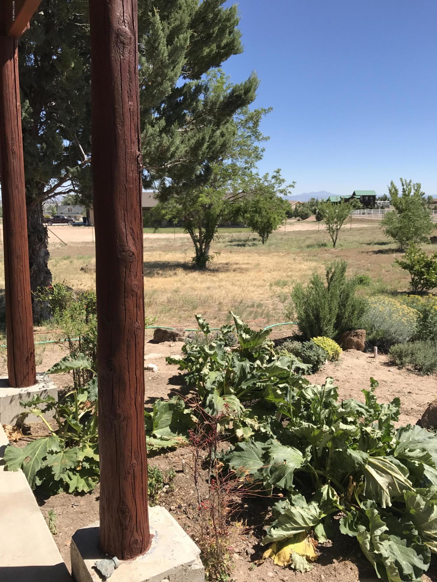 1120 North Moon Shadow Road Chino Valley, AZ 86323 - Photo 18 of 18 a view of a yard with wooden fence and floor