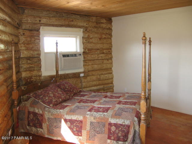 1120 North Moon Shadow Road Chino Valley, AZ 86323 - Photo 3 of 18 a bedroom with a bed and a window
