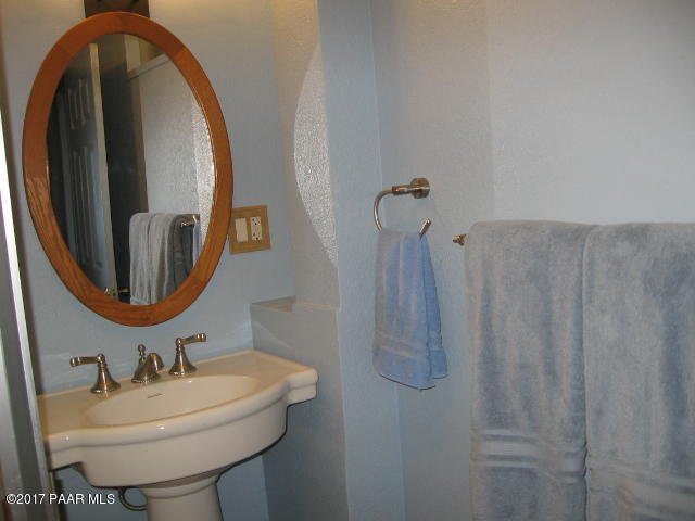 1120 North Moon Shadow Road Chino Valley, AZ 86323 - Photo 4 of 18 a bathroom with a sink and mirror