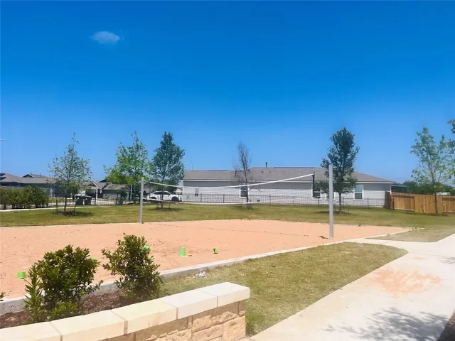 a view of a swimming pool and an outdoor space