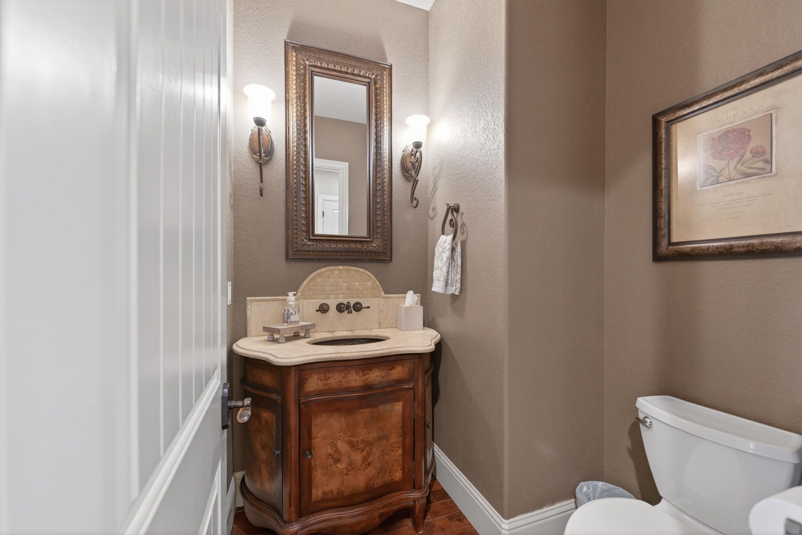 9009 Merlin Drive Redmond, OR 97756 - Photo 26 of 98 a bathroom with a toilet sink and mirror