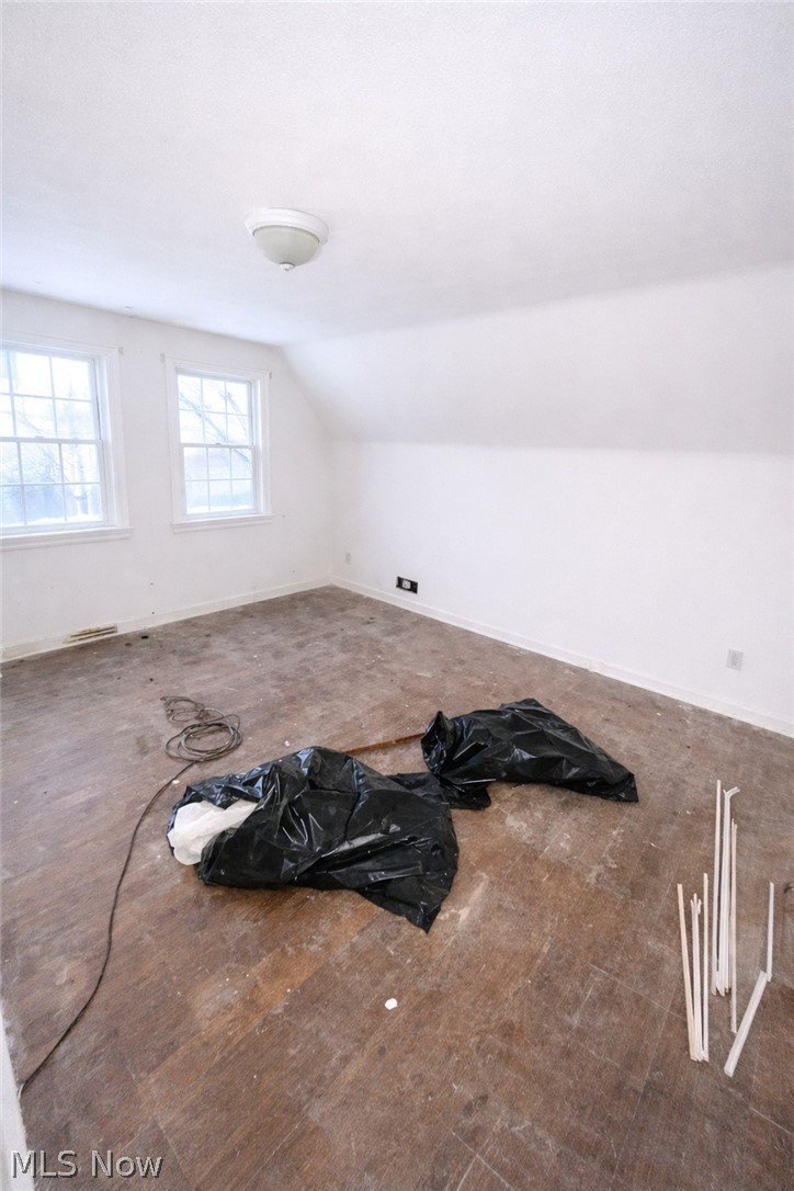 3575 Gridley Road Shaker Heights, OH 44122 - Photo 37 of 47 3rd Floor 2nd Rm with dark wood finished floors and lofted ceiling