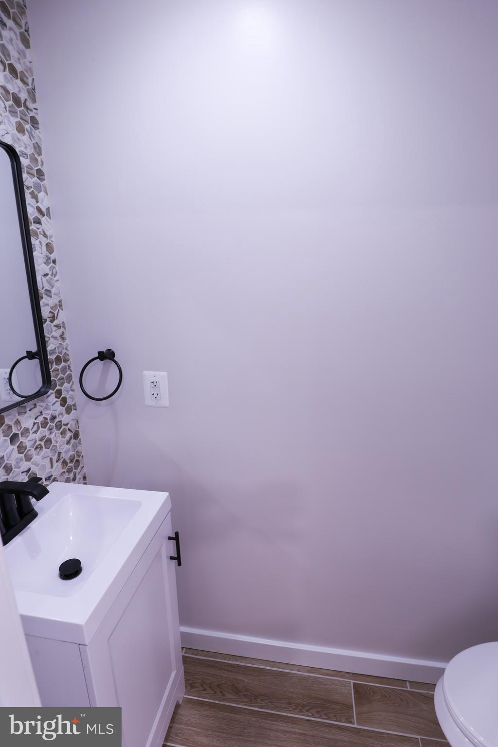 2039 Rosedale Street Northeast Washington, DC 20002 - Photo 7 of 18 a bathroom with a sink and a toilet