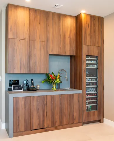 a view of a hallway to an empty room and fire place