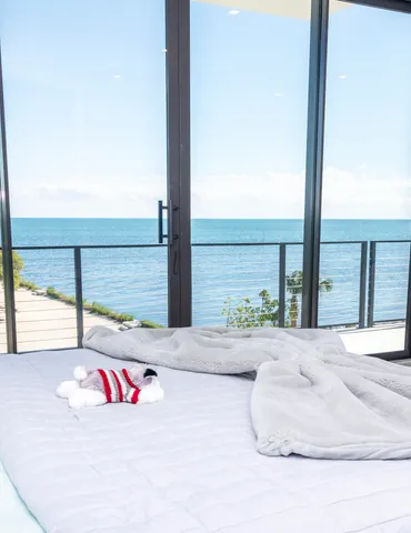 a bedroom with a bed and a flat screen tv