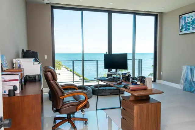 a room with gym equipment and a large window