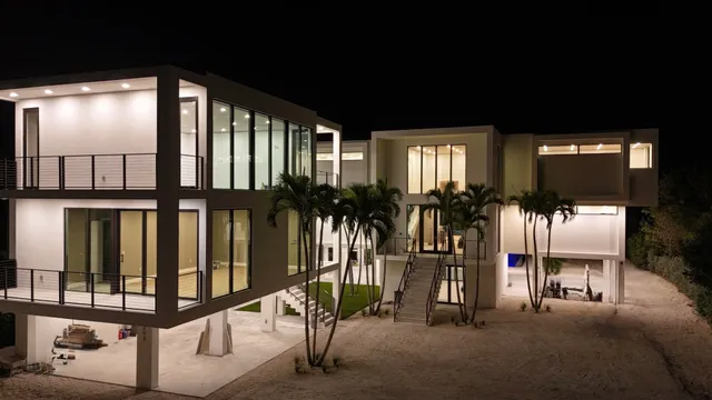 a house view with a swimming pool and sitting space