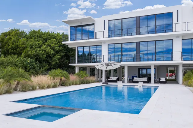 a view of a swimming pool with an outdoor space and seating area