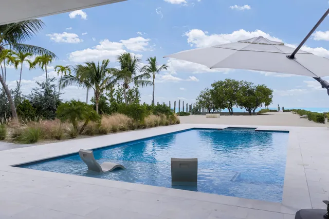 a view of house with a yard