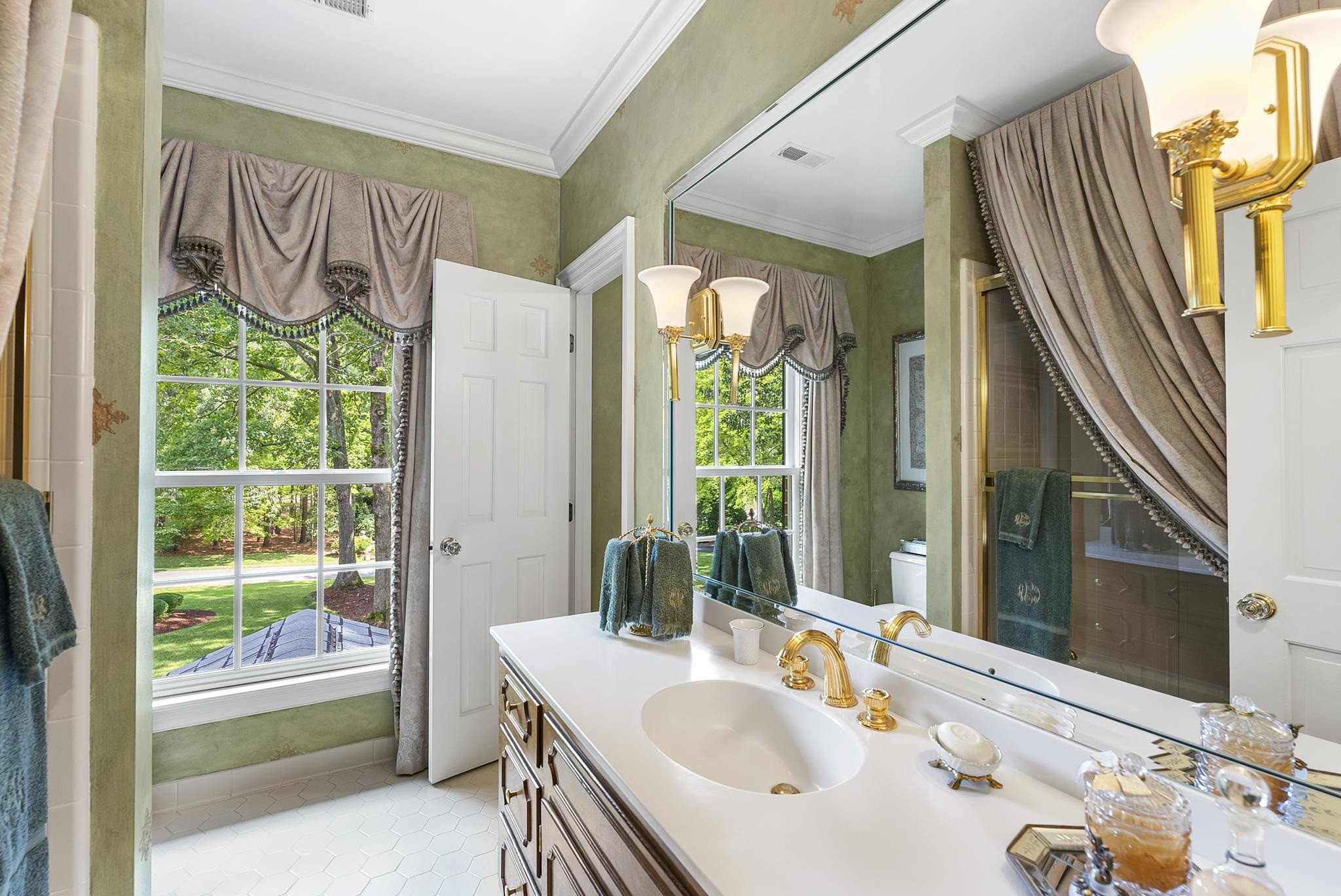 204 Carpathian Way Raleigh, NC 27615 - Photo 52 of 83 a bathroom with a sink and a mirror