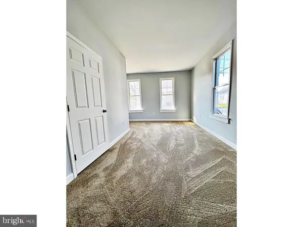 a view of a hallway with windows