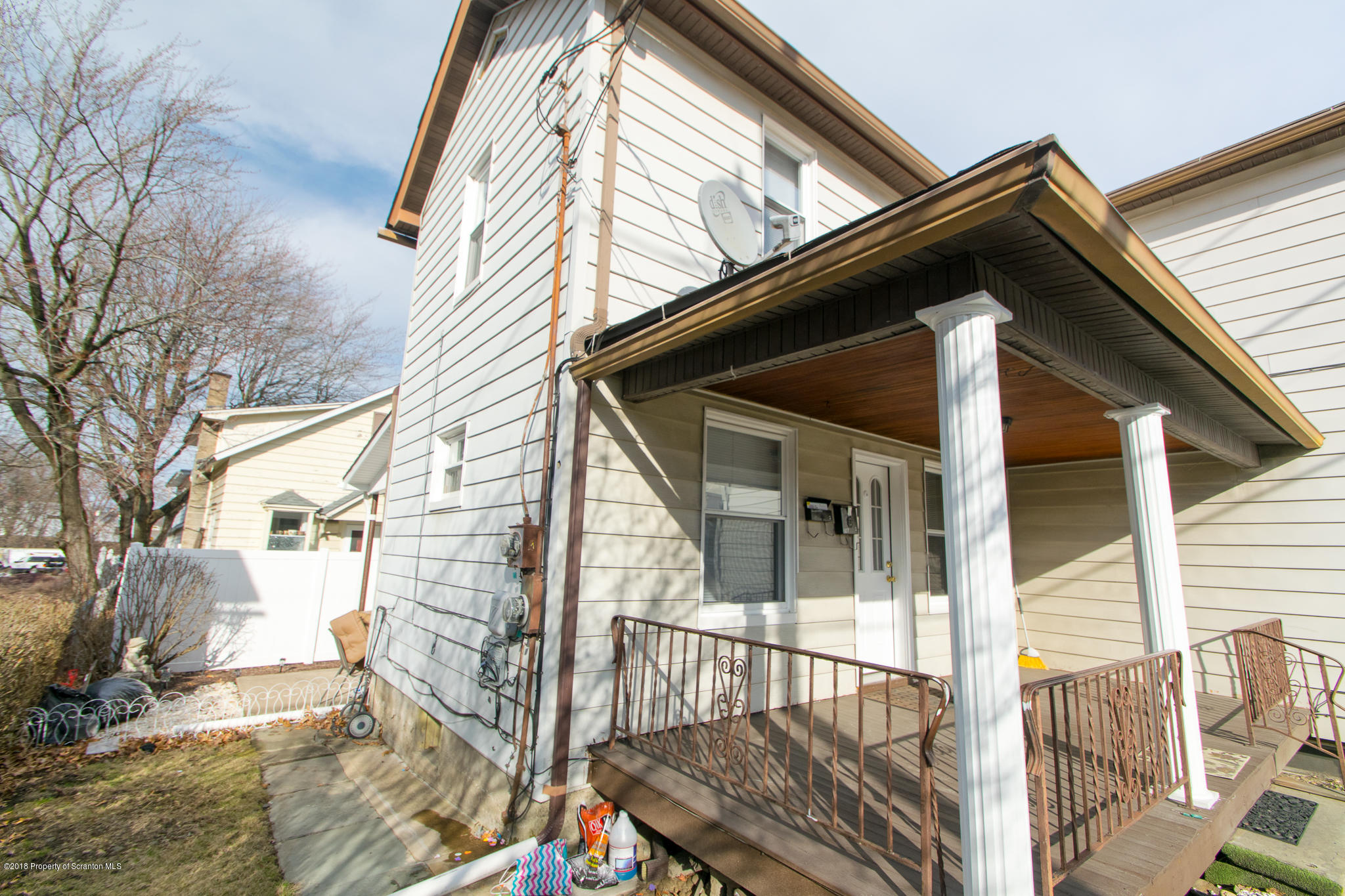 607 Spring Street Moosic, PA 18507 - Photo 5 of 24 a view of a balcony with wooden floor and fence