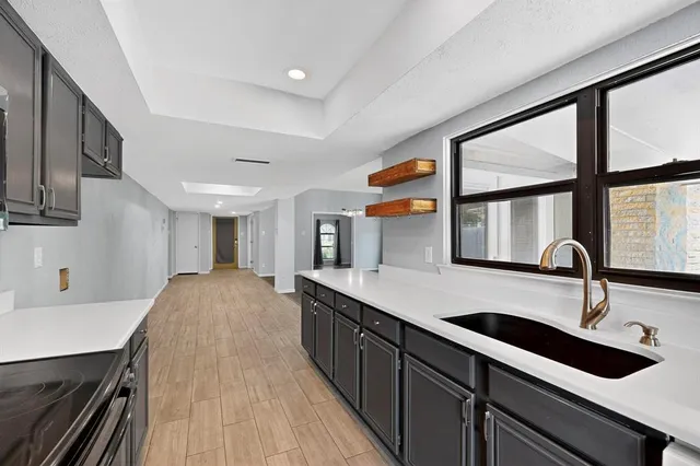 a view of an empty room with a ceiling fan