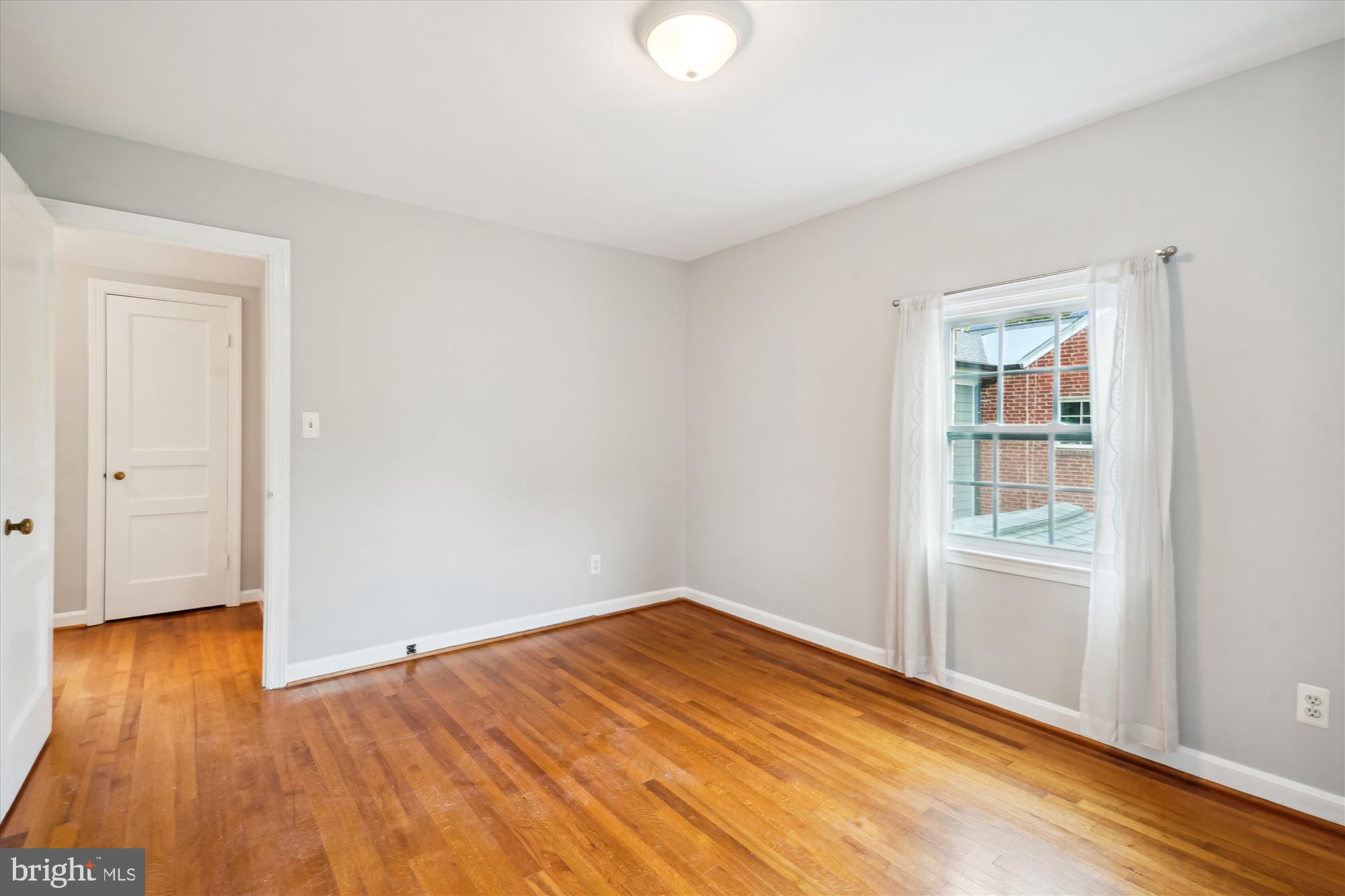 6124 12th Road North Arlington, VA 22205 - Photo 15 of 34 Primary upstairs bedroom with hardwood floors.