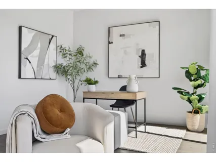 a bed sitting in a bedroom and lamp
