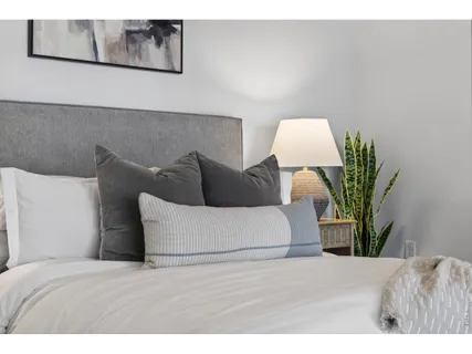 a bedroom with a bed and closet