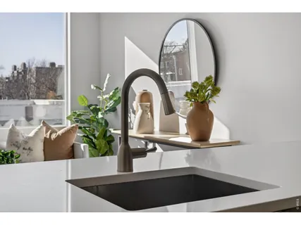 a kitchen with a sink and cabinets