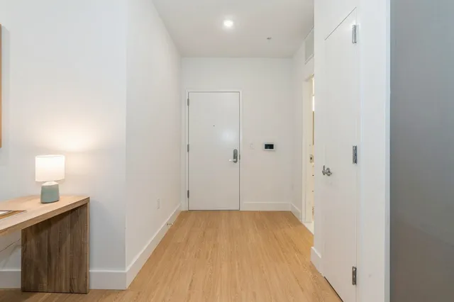 a view of a hallway with washer and dryer