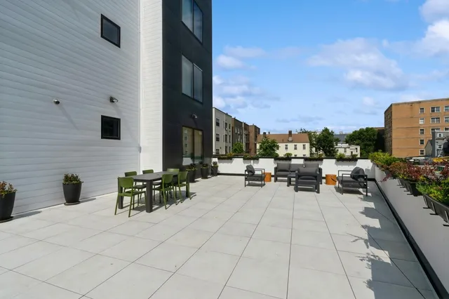 a dining room with furniture and a chandelier