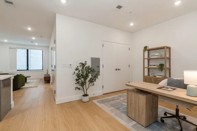 a view of a living room and dining room