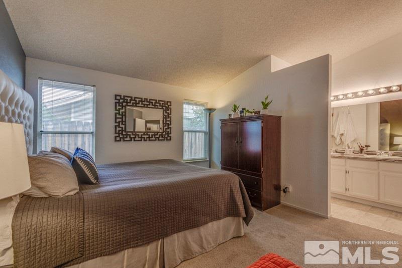 6006 White Water Way Reno, NV 89523 - Photo 12 of 20 a bedroom with a bed and dresser