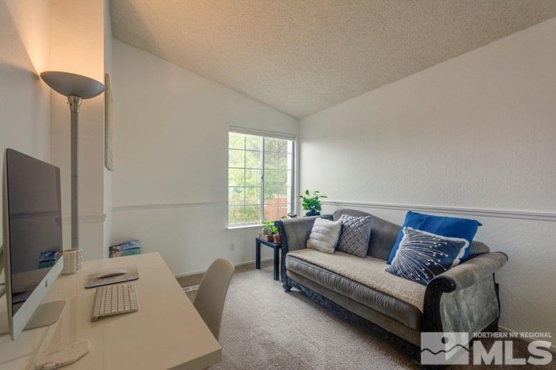 6006 White Water Way Reno, NV 89523 - Photo 13 of 20 a living room with furniture and a flat screen tv