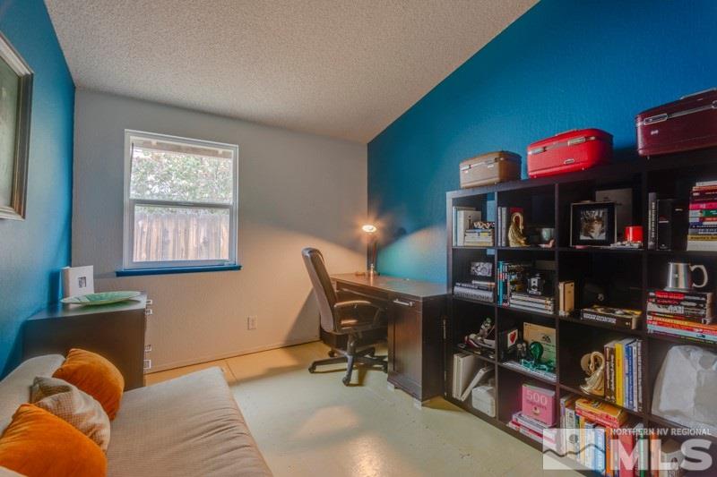 6006 White Water Way Reno, NV 89523 - Photo 14 of 20 a view of a workspace with furniture and a window