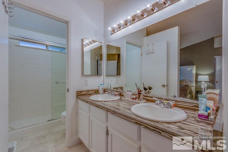 6006 White Water Way Reno, NV 89523 - Photo 15 of 20 a bathroom with a sink and a mirror
