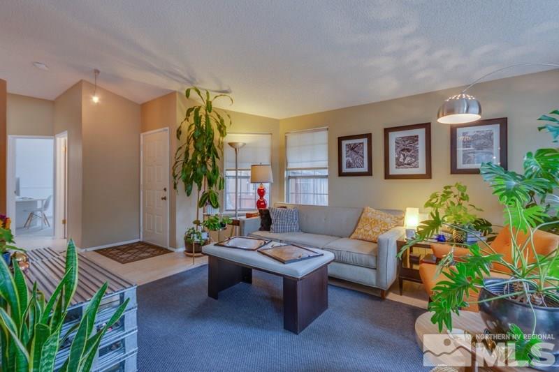 6006 White Water Way Reno, NV 89523 - Photo 3 of 20 a living room with furniture and a potted plant